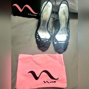 One pair of NINA dressy shoes. Black with silver sparkles. Size 9M